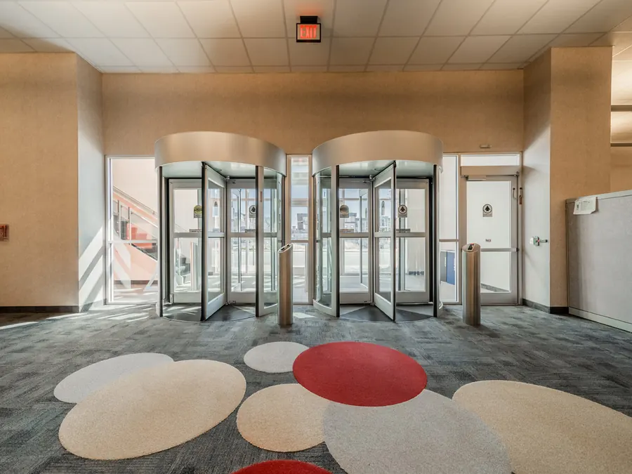 Annex entrance lobby with two revolving security doors and optical turnstiles