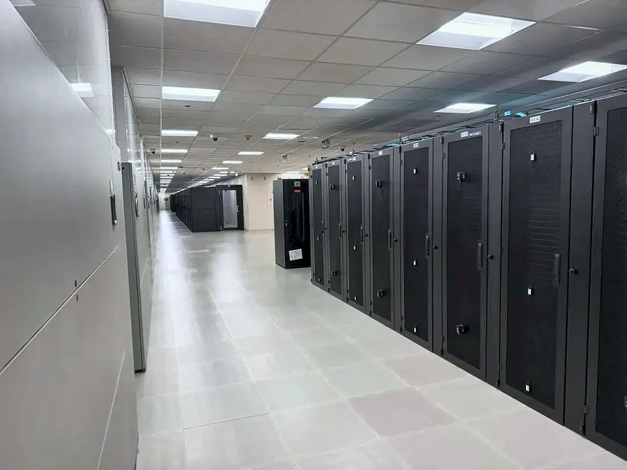 Long row of cabinets running the length of a data hall
